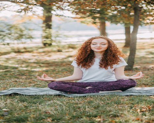 person meditating calm environment